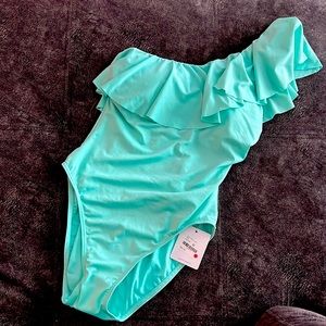 Teal full piece one shoulder bathing suit.
